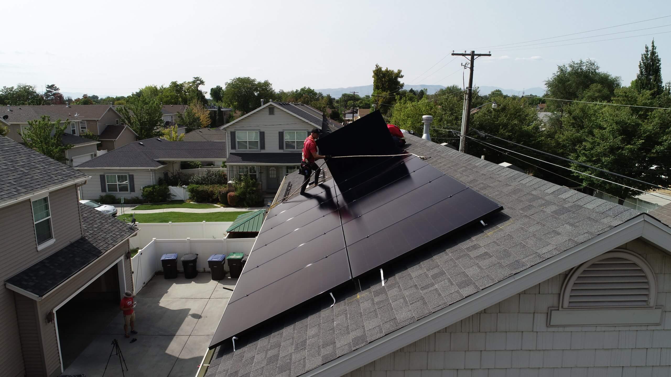 Solar Installers on roof installing solar panels